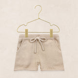 Lou Lou & Company Knit Shorts in Tan, cotton knit drawstring baby shorts on a hanger
