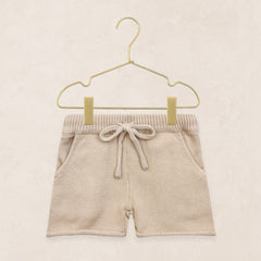 Lou Lou & Company Knit Shorts in Tan, cotton knit drawstring baby shorts on a hanger