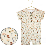 Lou Lou & Company Romper in Rachel, a cream floral short-sleeve henley romper on a hanger