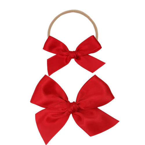 Lou Lou & Company Satin Bow in Cherry, two red satin bows on a soft nylon headband