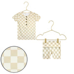 Lou Lou & Company Shortie Set in Austin, a cream and tan checkered henley tee and shorts on hangers