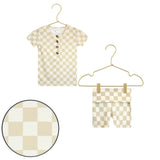 Lou Lou & Company Shortie Set in Austin, a cream and tan checkered henley tee and shorts on hangers