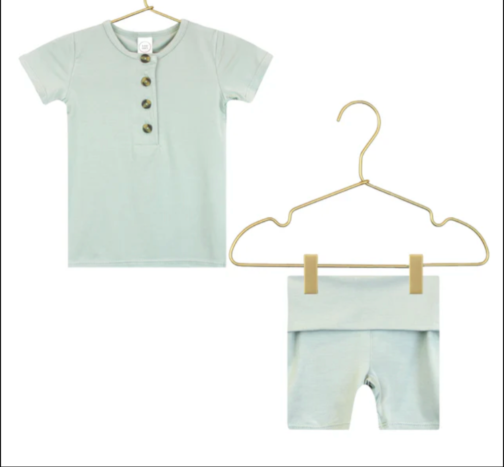 Lou Lou & Company Shortie Set in Joey, a sage green henley tee and shorts on hangers