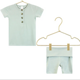 Lou Lou & Company Shortie Set in Joey, a sage green henley tee and shorts on hangers