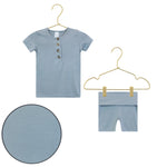 Lou Lou & Company Shortie Set in Leo, a slate blue henley tee and shorts on hangers