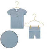 Lou Lou & Company Shortie Set in Leo, a slate blue henley tee and shorts on hangers