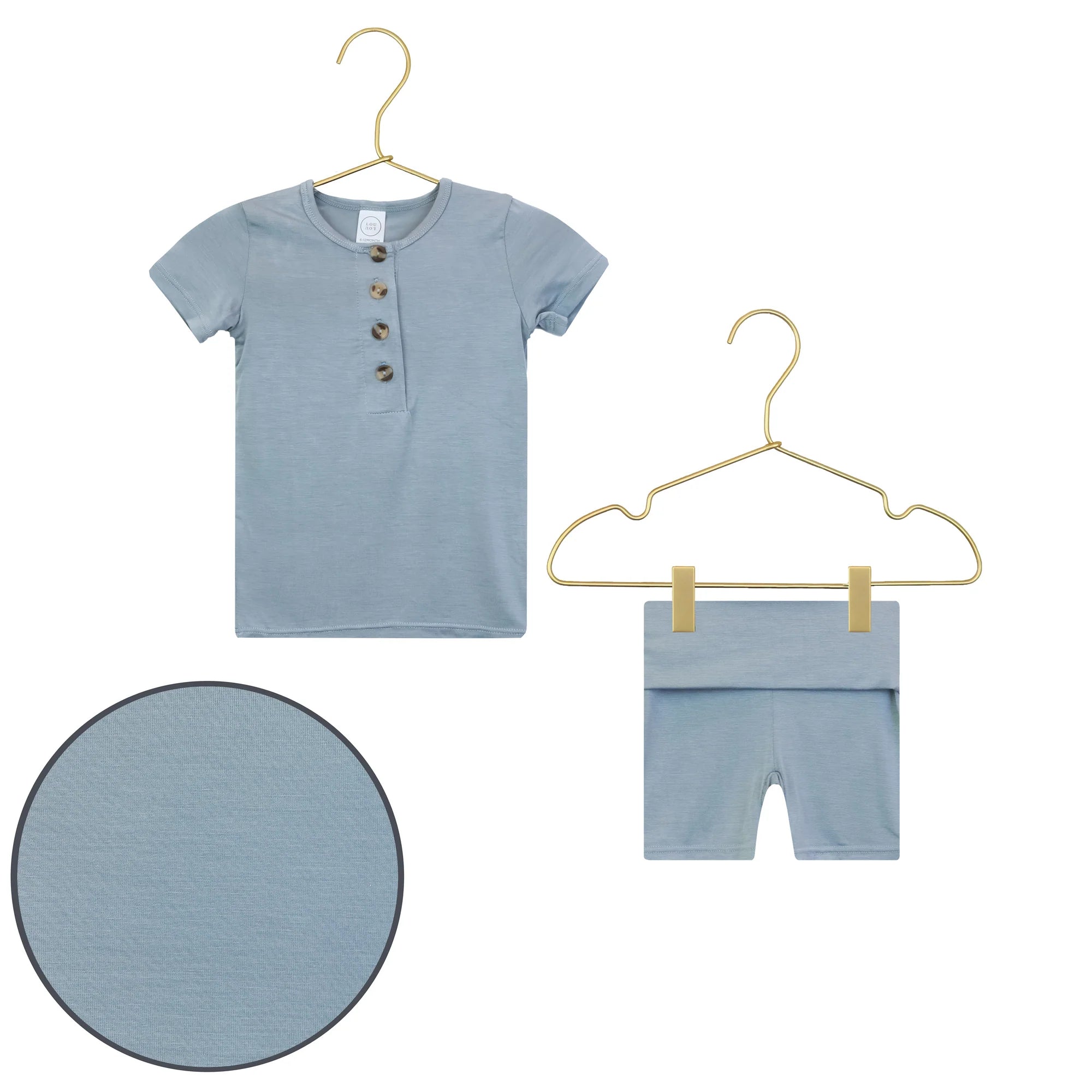 Lou Lou & Company Shortie Set in Leo, a slate blue henley tee and shorts on hangers