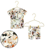 Lou Lou & Company Shortie Set in Nellie, a cream floral henley tee and shorts on hangers