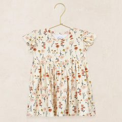 Lou Lou & Company Twirl Dress in Rachel, a cream floral flutter-sleeve dress on a hanger
