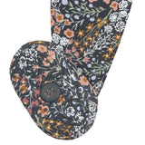 Close-up of the non-slip grip sole on the Lou Lou & Company Zipper Footies in Bae