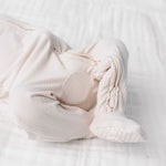Close-up of the footed legs and ribbed fabric on the Lou Lou & Company Zipper Footies in Cove