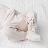 Close-up of the footed legs and ribbed fabric on the Lou Lou & Company Zipper Footies in Cove