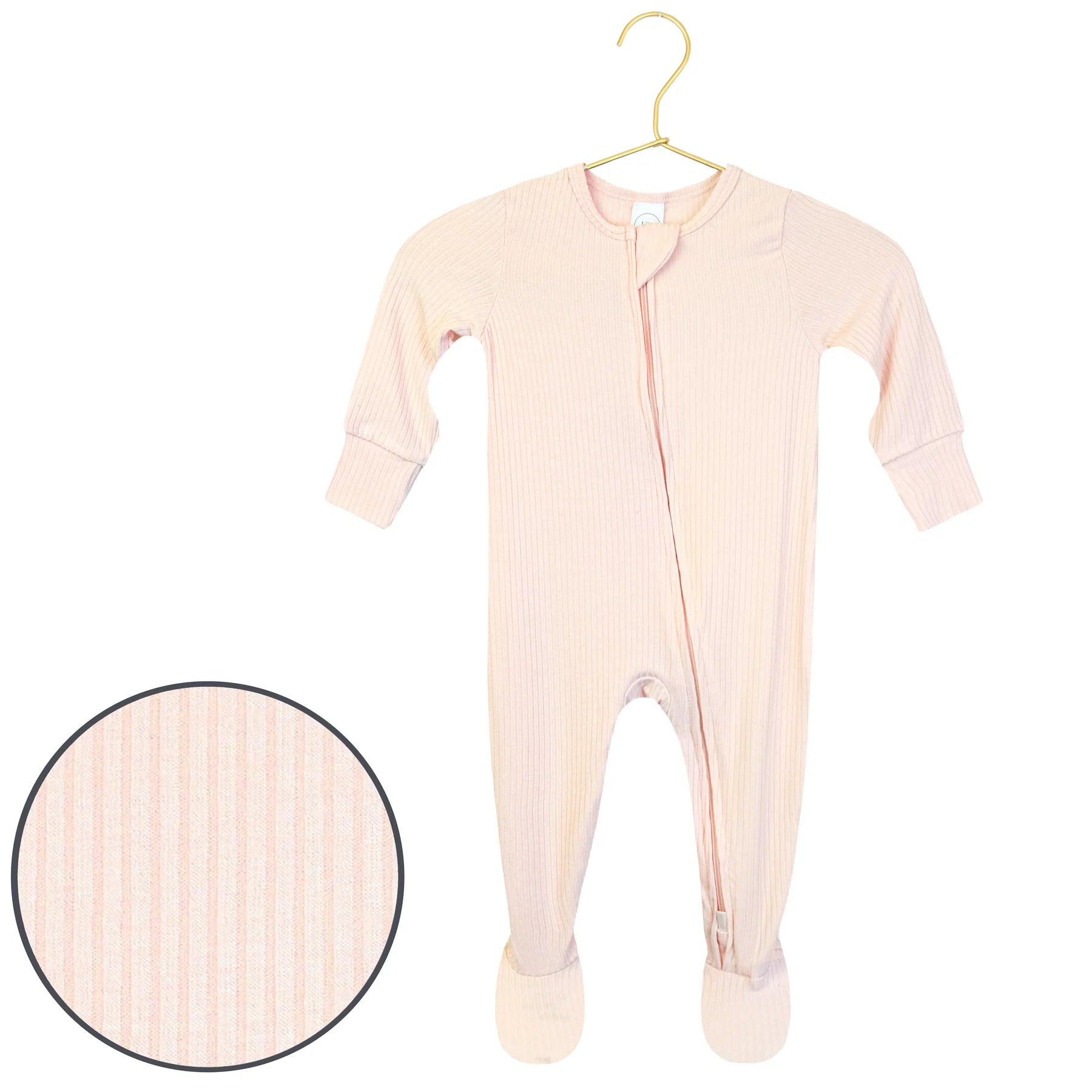 Lou Lou & Company Zipper Footies in Rosie, a light pink ribbed baby footie with a front zipper, on a hanger with a fabric swatch
