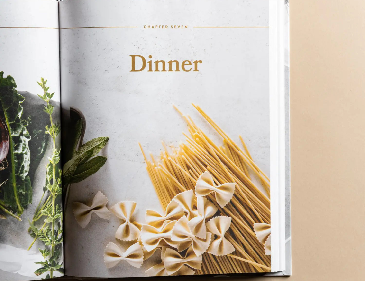 Magnolia Table Cookbook Volume 2 open to the Dinner chapter with pasta and herbs