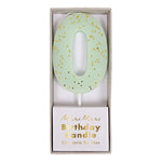 Meri Meri Colored Number Candle 0 in mint green shown in its Birthday Candle box
