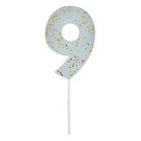 Meri Meri Colored Number Candle 9, a pale blue birthday candle with gold glitter flecks
