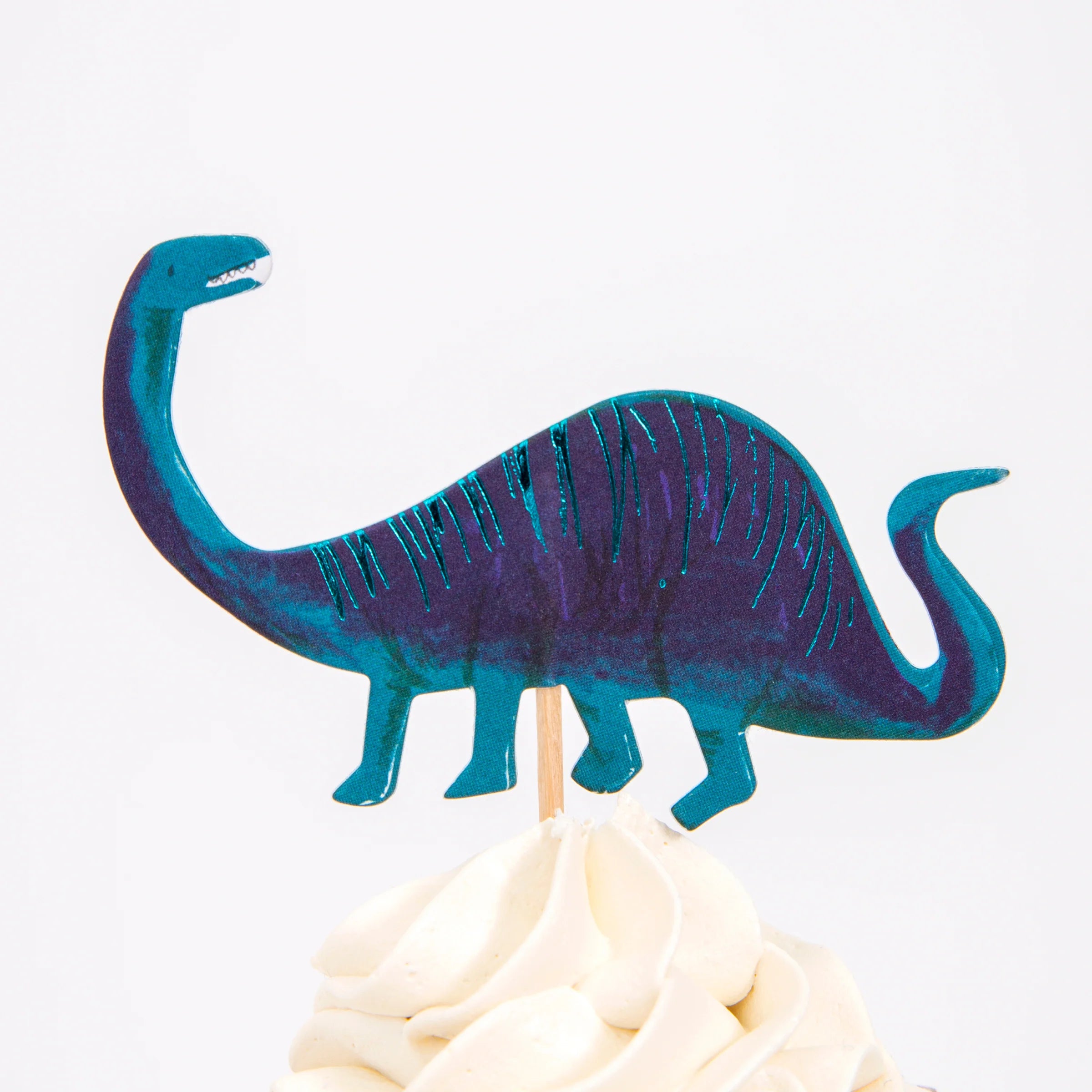 Meri Meri Dinosaur Kingdom Cupcake Kit navy brachiosaurus topper on a frosted cupcake