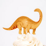 Meri Meri Dinosaur Kingdom Cupcake Kit orange brontosaurus topper on a frosted cupcake