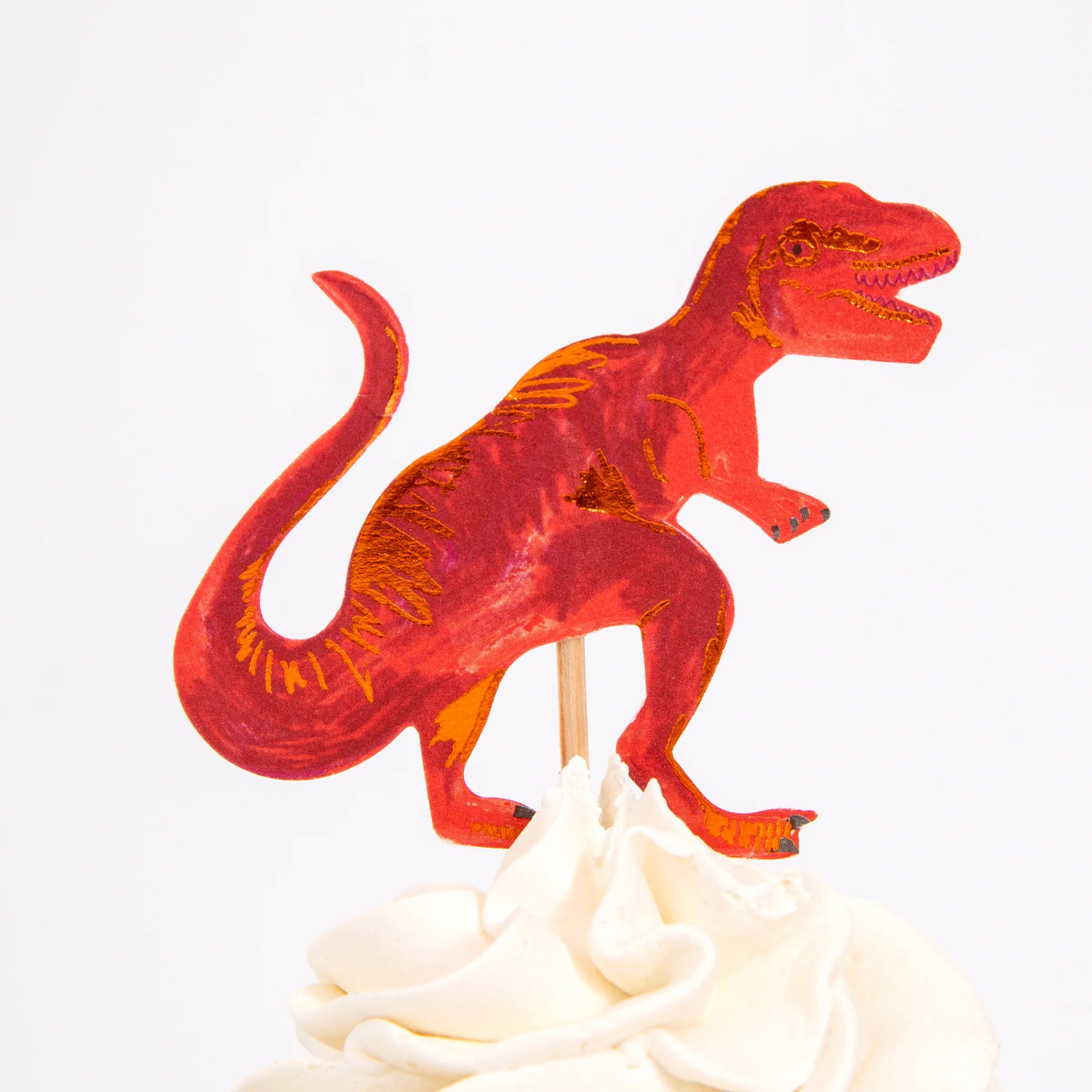 Meri Meri Dinosaur Kingdom Cupcake Kit red T-rex topper on a frosted cupcake