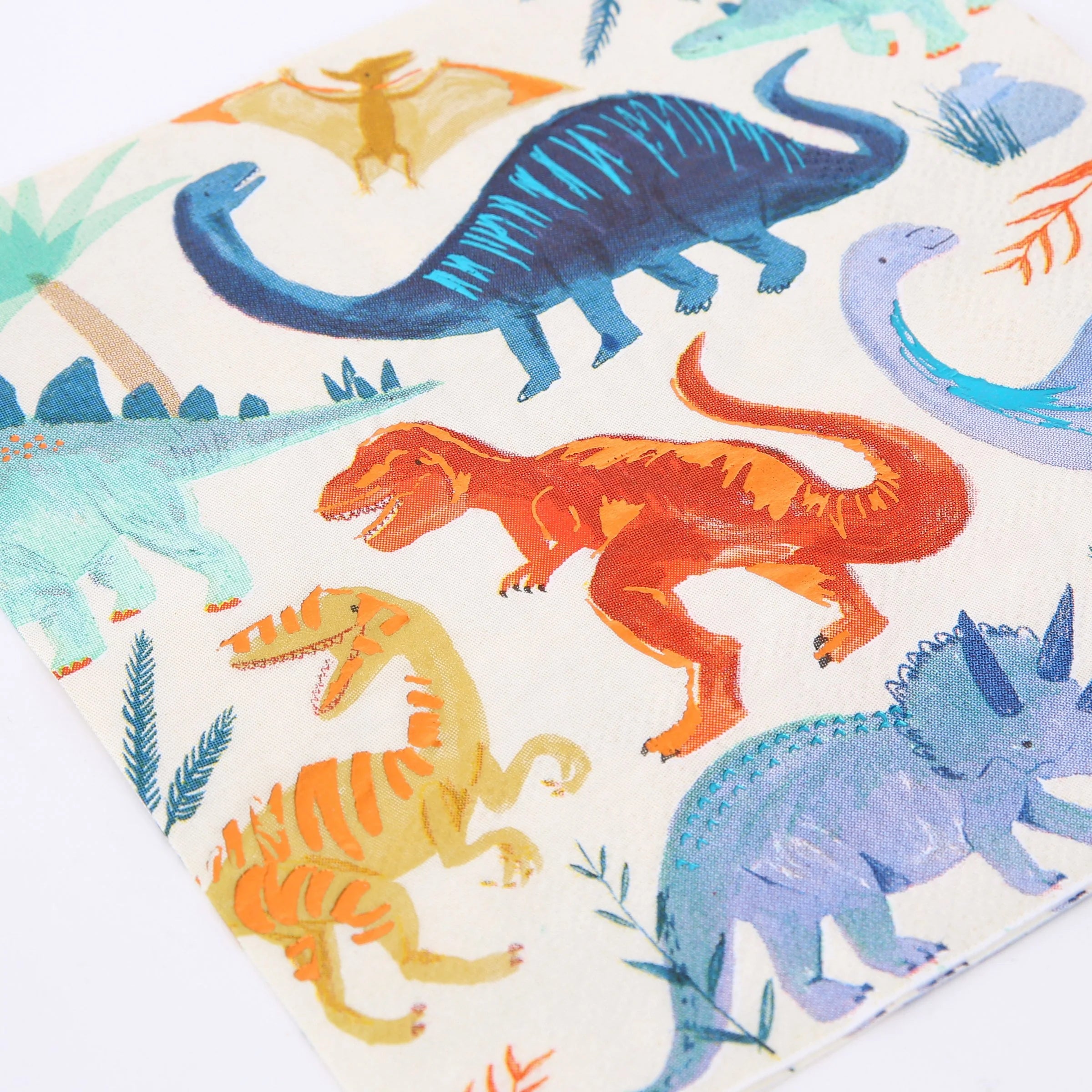 Close-up of the painted T-rex and brachiosaurus print on the Meri Meri Dinosaur Kingdom Large Napkins