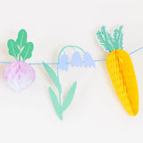 Close-up of the honeycomb radish, carrot and bluebell pieces on the Meri Meri Easter Vegetable Garden Garland
