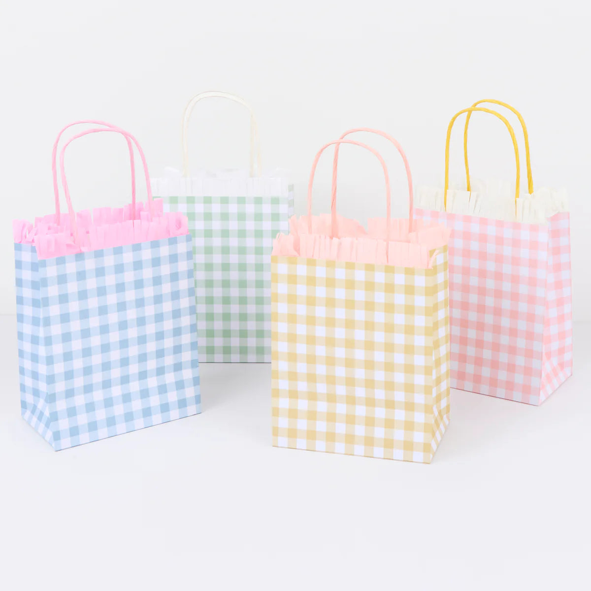 Meri Meri Gingham Fringe Party Bags in blue, yellow and pink gingham with fringe trim and twisted handles