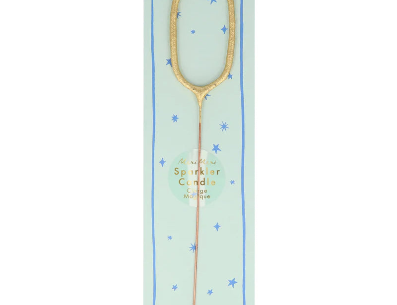 Meri Meri Gold Sparkler Number Candle 0 on its mint green card