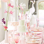 Pink princess party table with cakes and flowers set with Meri Meri Princess Large Napkins