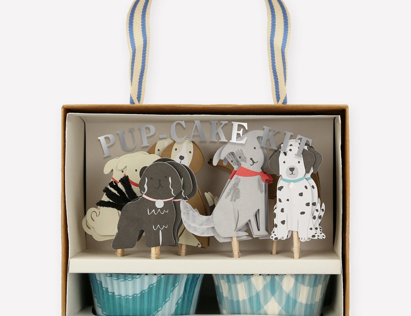 Meri Meri Puppy Cupcake Kit in its box with dog toppers and blue cupcake wrappers