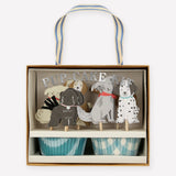 Meri Meri Puppy Cupcake Kit in its box with dog toppers and blue cupcake wrappers