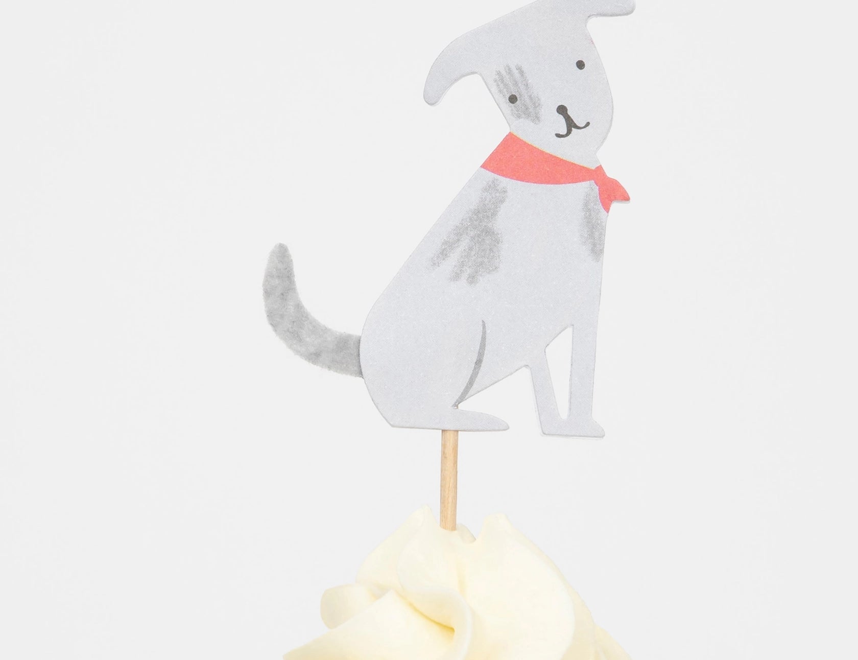 Meri Meri Puppy Cupcake Kit gray dog topper with a red collar on a frosted cupcake