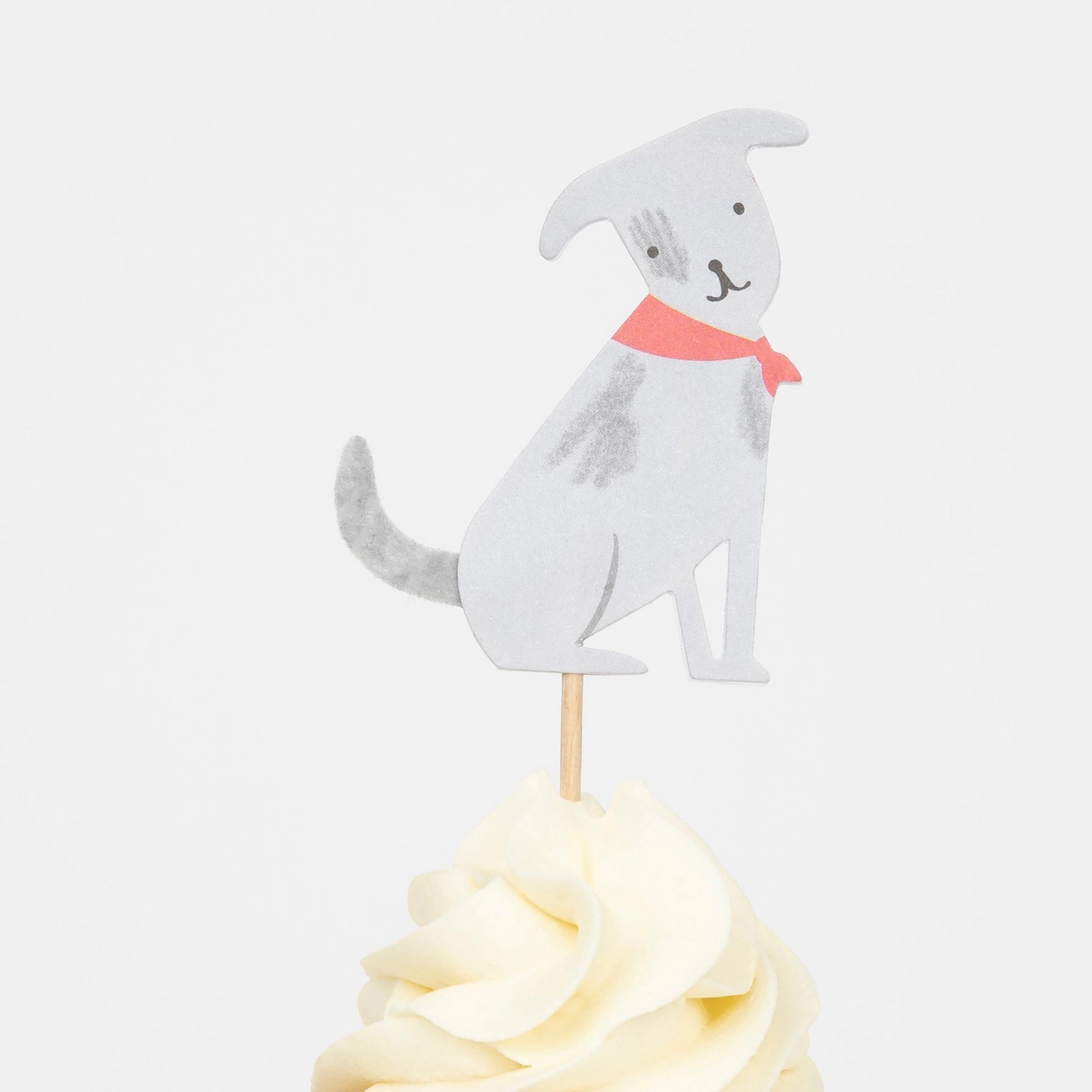 Meri Meri Puppy Cupcake Kit gray dog topper with a red collar on a frosted cupcake