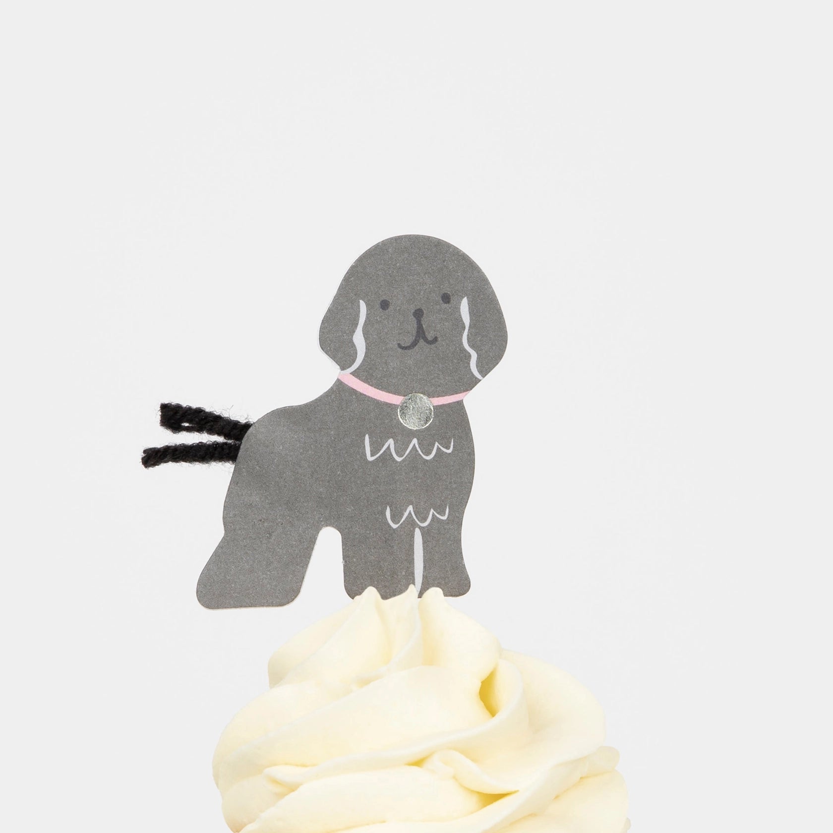 Meri Meri Puppy Cupcake Kit black poodle topper on a frosted cupcake
