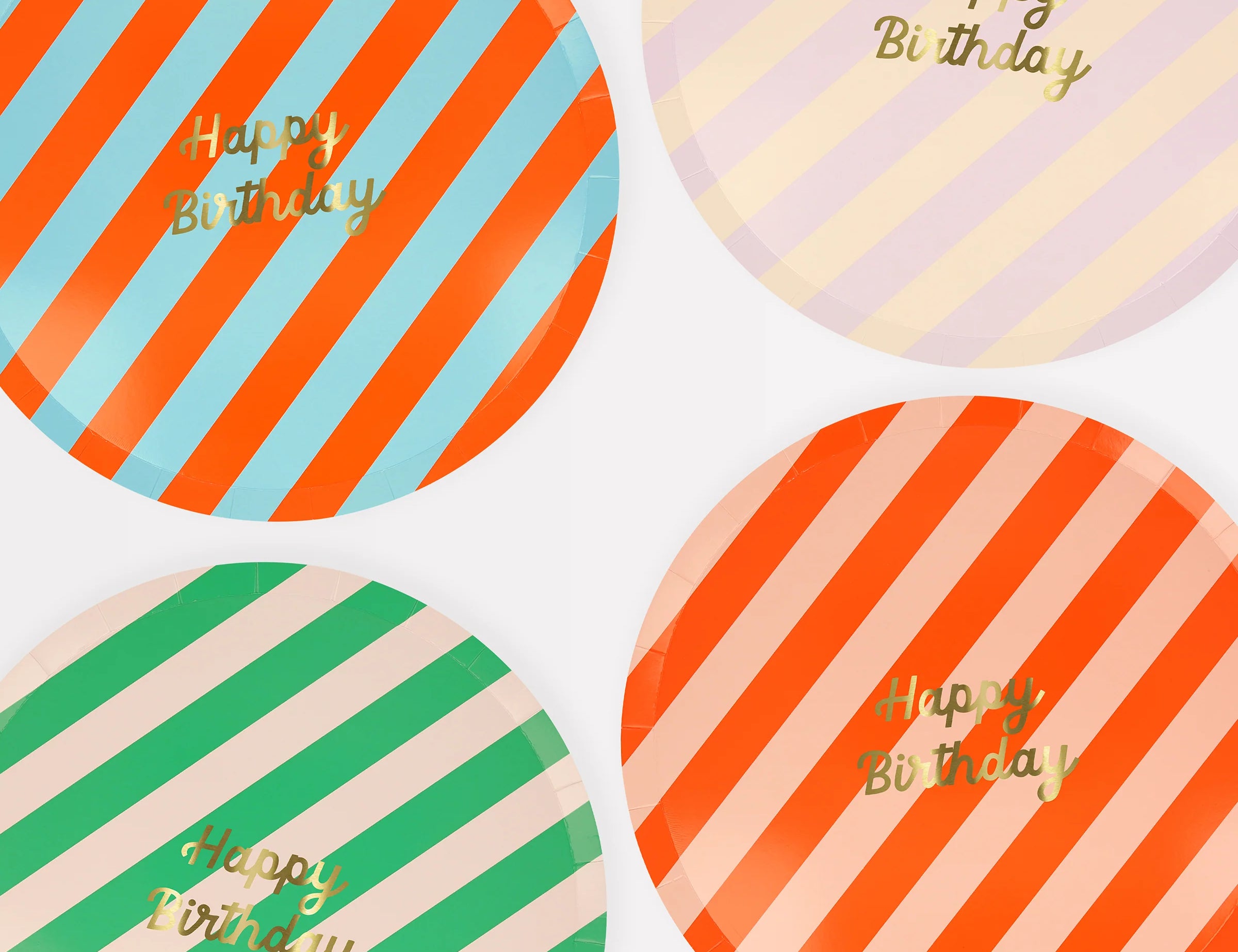 Meri Meri Stripe Happy Birthday Dinner Plates in red, green, blue and pink stripes with gold lettering