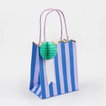 Meri Meri Stripe Party Bag in blue stripes with a mint honeycomb pom-pom and lilac handles
