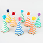 Meri Meri Stripe Party Hats, a set of striped cone hats in assorted colors with honeycomb pom-pom tops