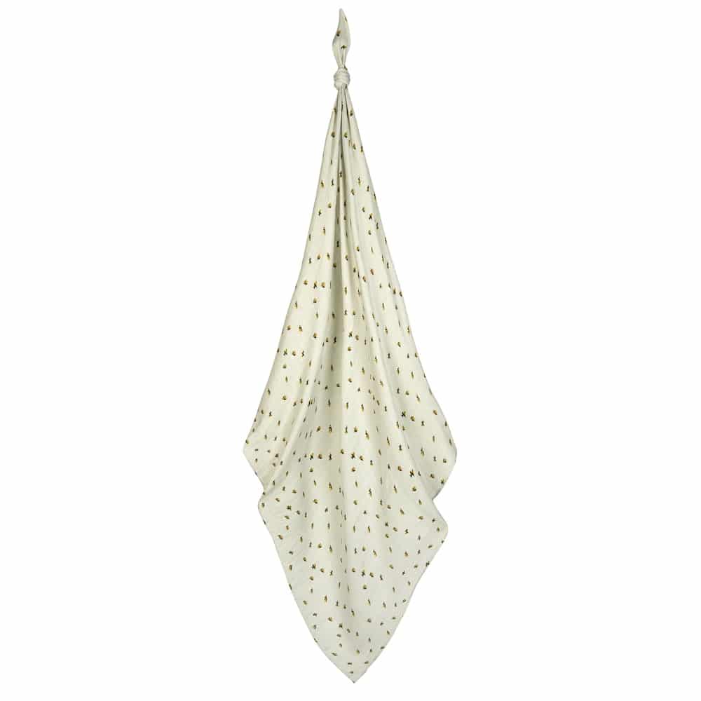 Milkbarn Bamboo Bumblebee Swaddle Blanket, sage green muslin swaddle with bumblebee print hanging on white