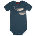 Milkbarn Blue Whale Short Sleeve One Piece, a navy blue baby bodysuit with a gray whale print