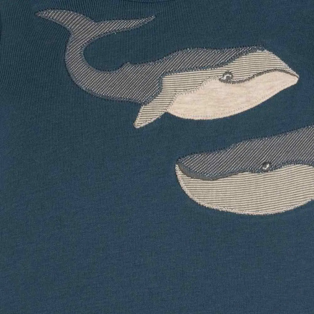 Close-up of the gray whale print on the navy Milkbarn Blue Whale Short Sleeve One Piece
