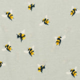 Close-up of the bumblebee print on the sage Milkbarn Bumblebee Short Sleeve One Piece