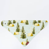 Milkbarn Camping Three-Layer Kerchief Bib, a light blue bandana bib with a pine tree and tent print
