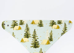 Milkbarn Camping Three-Layer Kerchief Bib, a light blue bandana bib with a pine tree and tent print