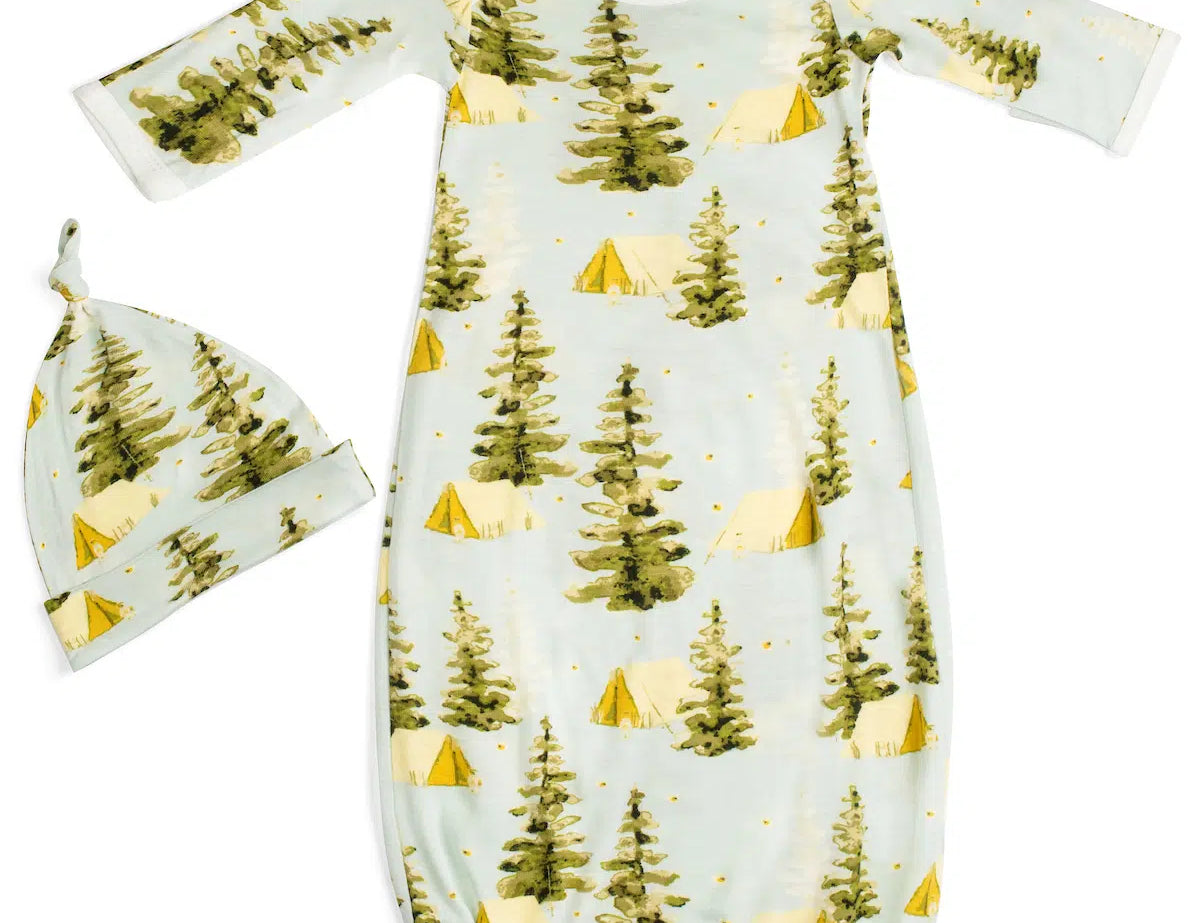 Milkbarn Camping Newborn Gown & Hat Set, a light blue gown and knotted hat with a pine tree and tent print