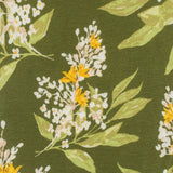 Close-up of the floral print on the Milkbarn Green Floral Short Sleeve One Piece