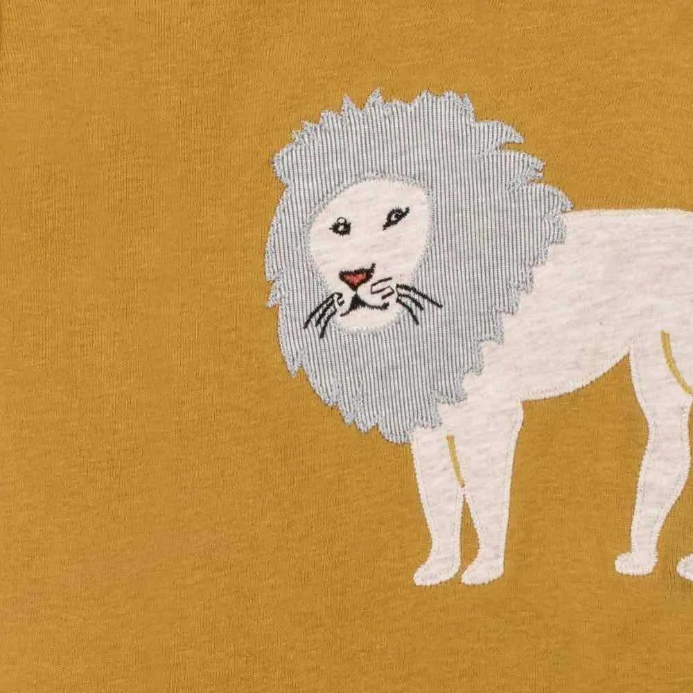 Close-up of the cream lion applique on the Milkbarn Lion Short Sleeve One Piece in mustard