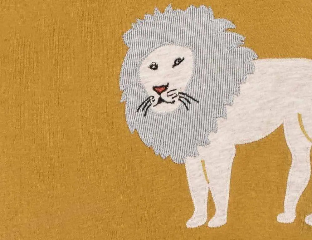 Close-up of the cream lion applique on the Milkbarn Lion Short Sleeve One Piece in mustard