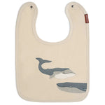 Milkbarn Whale Linen Two-Layered Bib, a cream linen bib with two appliqued gray whales