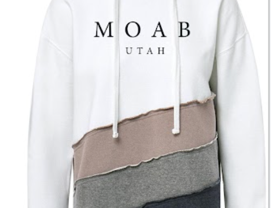 Two tone Moab colorblock hoodie in cream and taupe with a raw edge seam and Moab Utah lettering