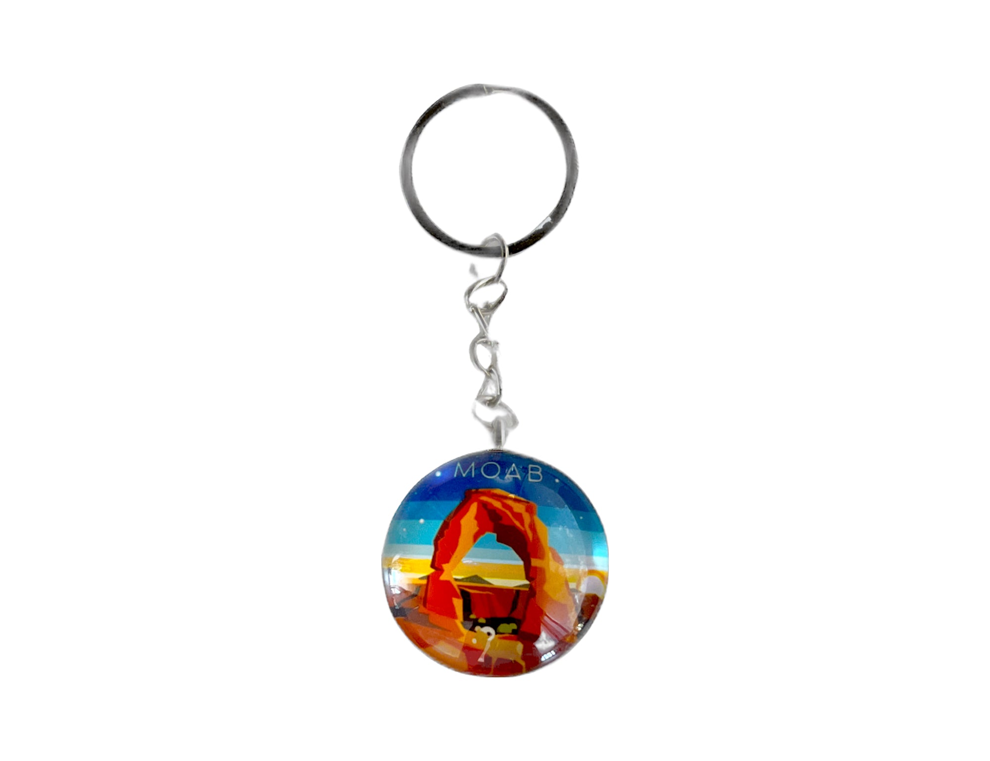 Round glass Moab keychain with Delicate Arch under a coral and peach sunset