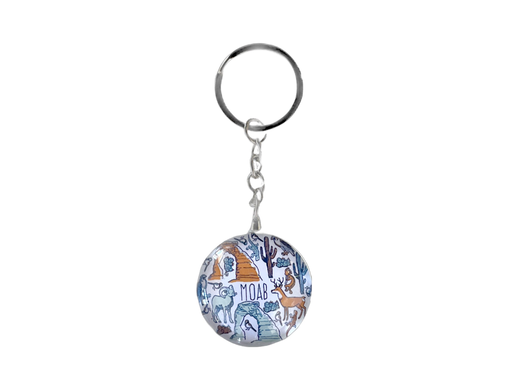 Round glass Moab keychain patterned with desert animals, cacti and arches in fine linework